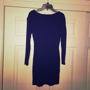 Black cocktail dress with cut out sleeves.